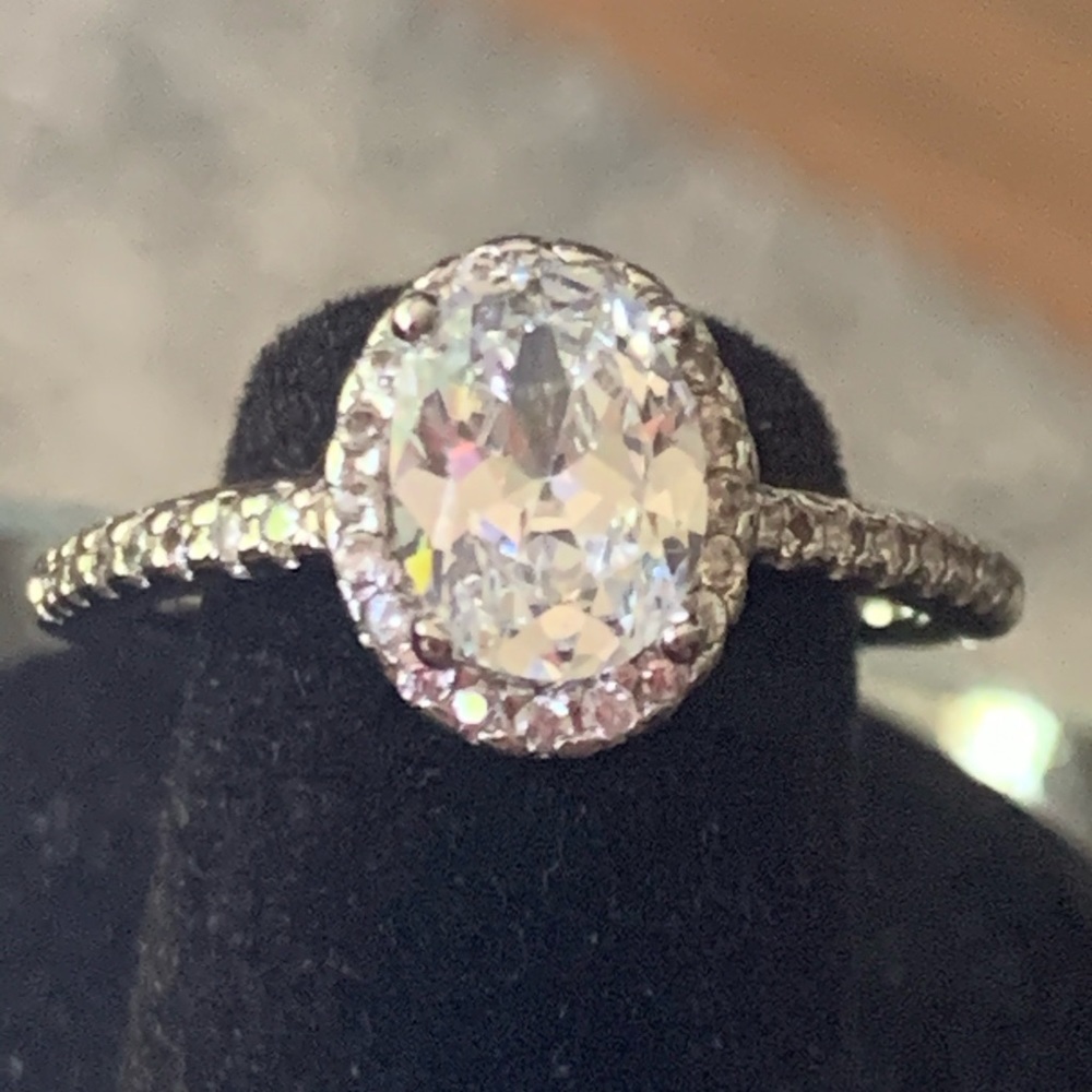 Women’s oval white sapphire center stone